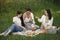 Group of girls play bacgamon in a park