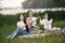 Group of girls play bacgamon in a park