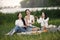 Group of girls play bacgamon in a park