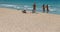 A group of girls sunbathe in El Arenal beach in Mallorca wide