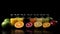 Group of glasses of fresh colored juice with fresh berries, fruits stand in row, black background. AI generated.