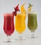 Group of glasses of juices with fruits
