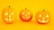 Group of glowing Halloween pumpkins with smile, isolated on orange background, 3D rendering