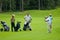 Group golfers, golfer\'s swing on golf feeld
