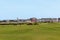 A group of golfers playing the most famous links golf course in the world