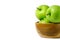 Group of green Apple granny smith above wooden bowl / basket isolated on white background