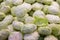 Group of green cabbages in a supermarket. Green cabbage pile on sale in supermarket,