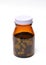 Group of green capsule medicine in bottle