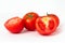 Group of haft tomatoes sliced on white background