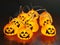Group of Halloween pumpkin string lights glowing on the table for Halloween party decoration