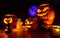 Group of halloween pumpkins on the dark background, dark scenery