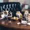 A group of hamsters sitting at a table with food. AI generative image.