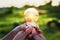 group hand holding lightbulb with sunset. concept idea solar ene