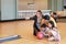 Group of happiness asian family father, mother, son and daughter playing bowling in sport club with happy smiling face during