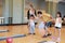 Group of happiness asian family father, mother, son and daughter playing bowling in sport club with happy smiling face during