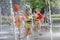 Group of happy Cheerleaders enjoy jogging through the fountain