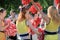 Group of happy Cheerleaders enjoy jogging through the fountain