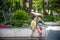 Group of happy children playing outdoors. Kids having fun in park during summer vacation. Friends sitting in sunglasses and