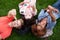 Group of happy college students in grass