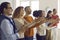 Group of happy diverse people applauding thanking speaker for enjoyable presentation