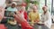 Group of happy diverse senior friends cooking together and taking selfie at christmas time