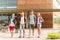 Group of happy elementary school students walking