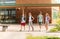 Group of happy elementary school students walking