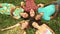 Group of happy friends forming a circle with their heads laying back on grass