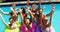 Group of happy friends having fun together in swimming pool