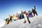 Group of happy friends skiers and snowboarders
