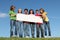 Group of happy kids,blank sign