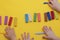 group of happy kids holding toy knives to cut plasticine