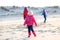 Group of happy kids playing on the beach