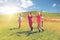 Group of happy kids running outdoors