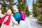 Group of happy kids throw snowballs during fight