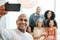 Group, happy and a man with family for a selfie, memory and photo together. Smile, bonding and a guy taking a picture on