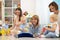 Group of happy moms with their babies in nursery