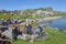 Group of happy people frying meet on barbeque grill at Melchsee-Frutt on the Swiss alps