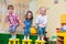 Group of happy preschool kids jumping