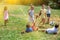 Group of happy schoolchildren playing football together