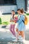 group of happy schoolgirls walking together