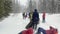 Group of happy ski tourists with big backpacks. Ski trip in the forests of Russia.
