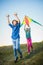 Group of happy and smiling kids playingin with kite outdoor