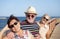 Group of happy smiling senior people enjoy sea excursion in summer vacation - concept of active playful elderly during retirement