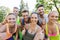 Group of happy sporty friends showing thumbs up