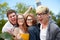 Group of happy students showing triumph gesture