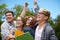 Group of happy students showing triumph gesture