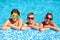 Group of happy teenage kids in the pool