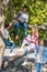 group of happy teenagers sitting on tree