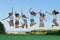 Group of happy teens jumping,
